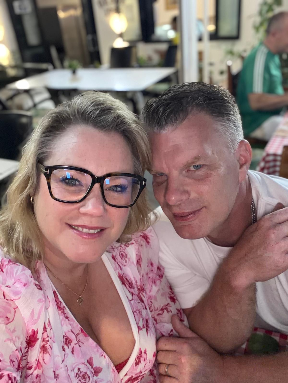 A couple smiling together in the garden at Casa Eden